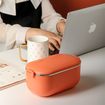 Lunch Box Chauffante Electrique Isotherme Inox Orange fermée à côté d'un ordinateur